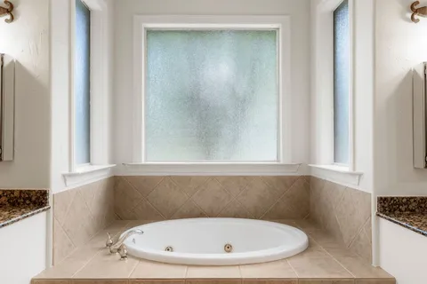 a white bath tub sitting in a bathroom