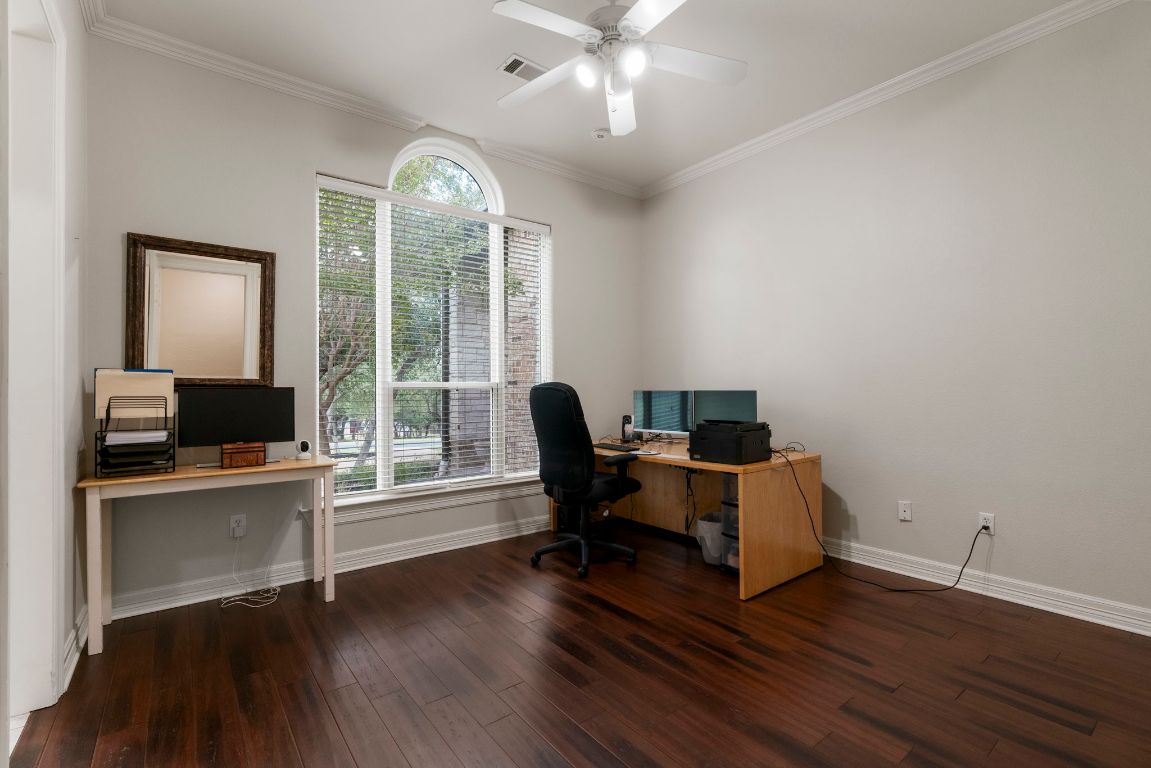 209 Goldridge Drive Georgetown, TX 78633 - Photo 25 of 40 a view of a workspace with wooden floor and a window