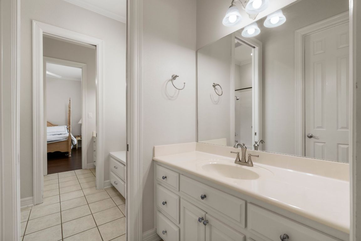 209 Goldridge Drive Georgetown, TX 78633 - Photo 26 of 40 a en suite bathroom with a sink a toilet and a large mirror