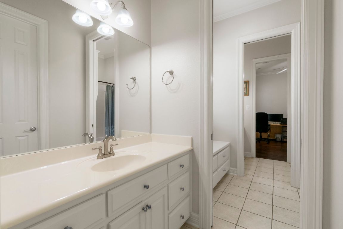 209 Goldridge Drive Georgetown, TX 78633 - Photo 27 of 40 a bathroom with a sink a vanity and a mirror
