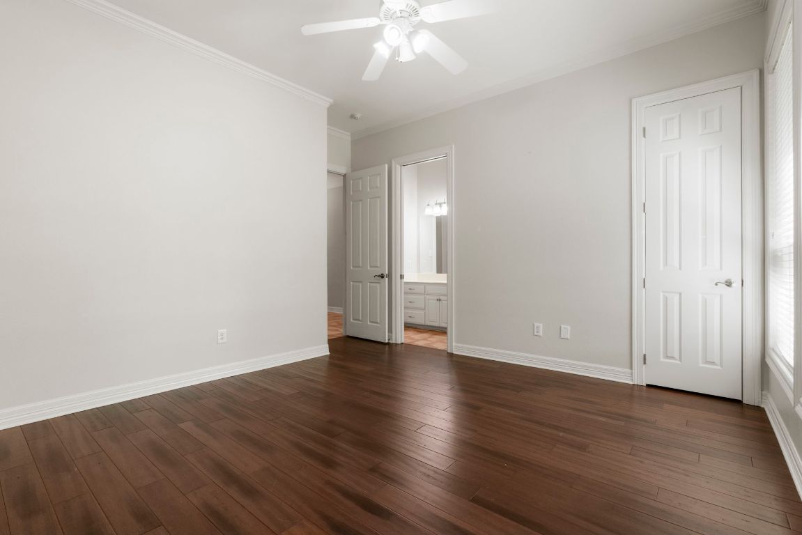 209 Goldridge Drive Georgetown, TX 78633 - Photo 32 of 40 an empty room with wooden floor and windows