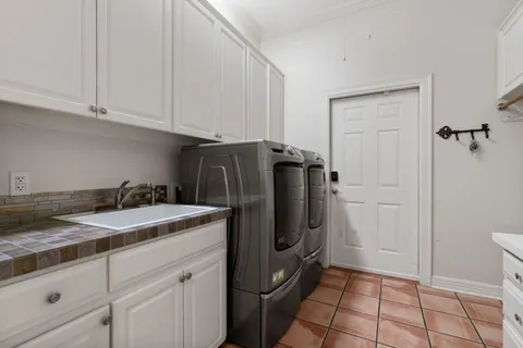 a kitchen with a refrigerator and cabinets