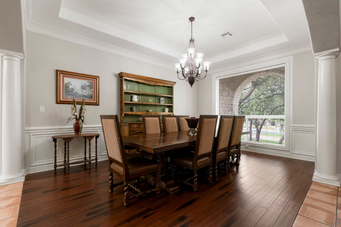 209 Goldridge Drive Georgetown, TX 78633 - Photo 5 of 40 a view of a dining room with furniture wooden floor and chandelier