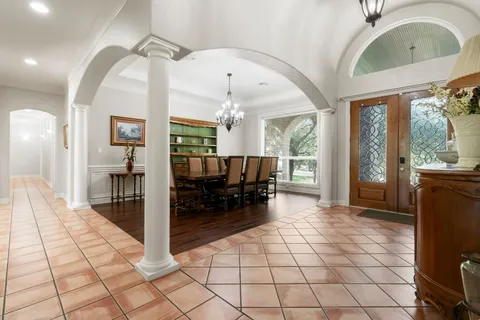 a lobby with furniture and wooden floor