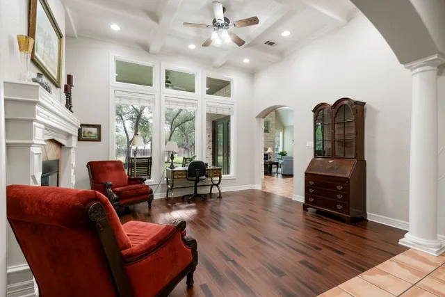 a living room with furniture and wooden floor