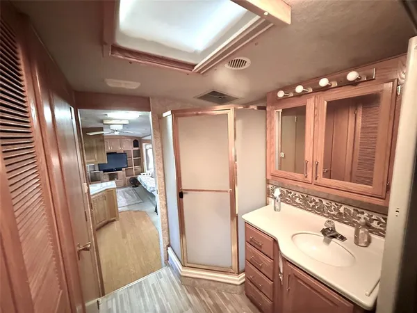 a kitchen with a refrigerator and a sink