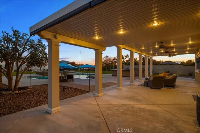 a building outdoor space with patio furniture and a potted plant