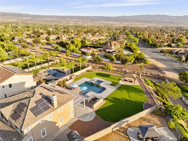 an aerial view of residential houses with outdoor space