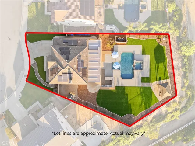 an aerial view of a house with swimming pool