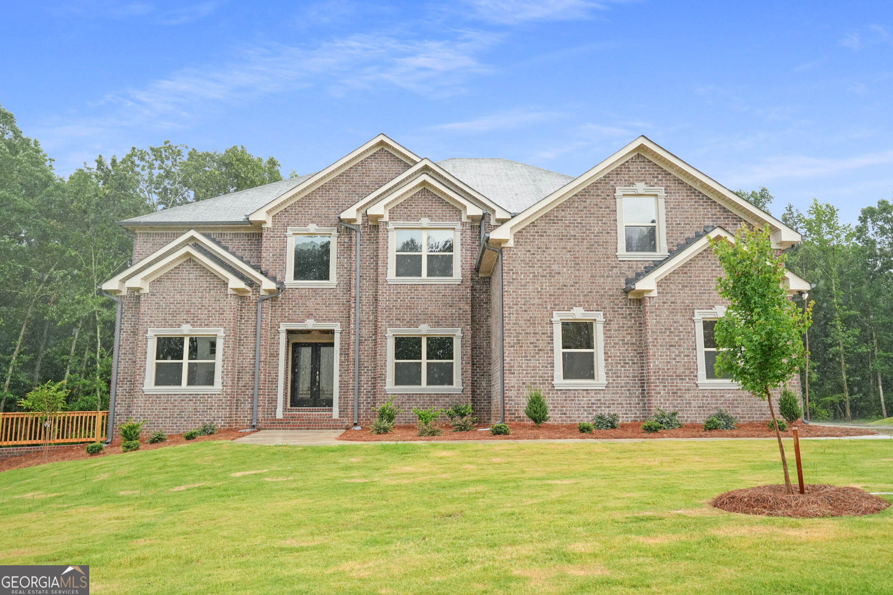 211 Lotus Lane Covington, GA 30016 - Photo 1 of 1 a front view of a house with a yard