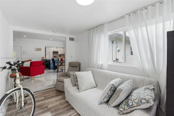 a living room with furniture and a window