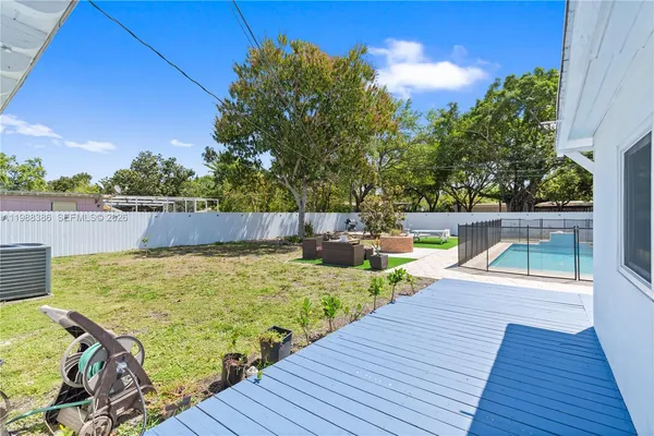 a view of a swimming pool with a patio