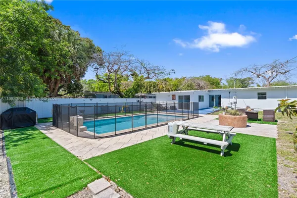 a view of a wooden deck and a garden