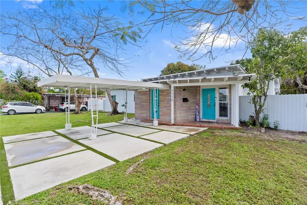front view of a house with a yard