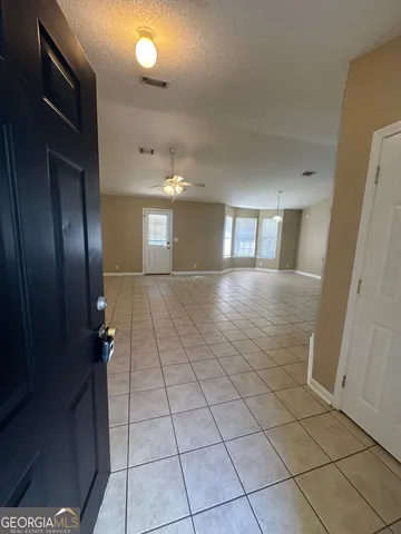 a view of a hallway with windows