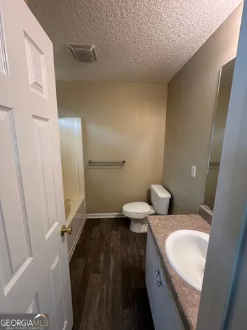 a bathroom with a sink and toilet