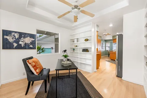 a view of a dining room with furniture and a rug