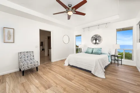 a bedroom with a bed and a table in it
