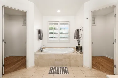 a bathroom with a bathtub and shower