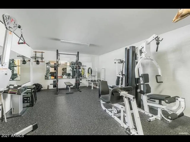 a view of a livingroom with furniture and a window