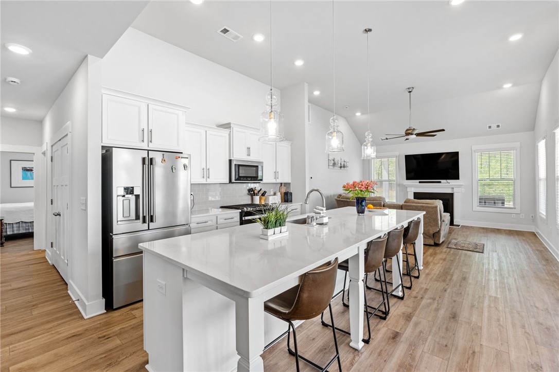 210 Maverick Trail Central, SC 29630 - Photo 11 of 41 This bright kitchen with a large island flows seamlessly into the living space, perfect for modern living.