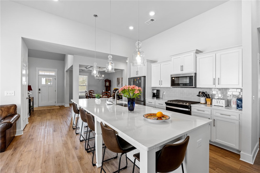 210 Maverick Trail Central, SC 29630 - Photo 13 of 41 This spacious kitchen features an expansive island and gleaming appliances, perfect for everyday living.