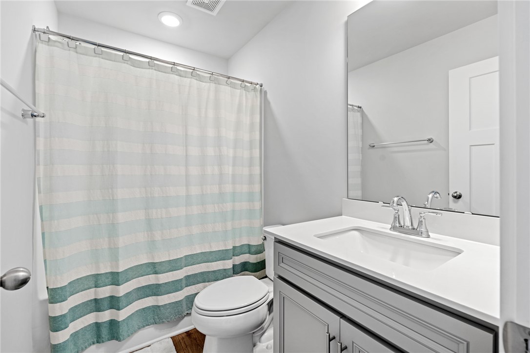 210 Maverick Trail Central, SC 29630 - Photo 29 of 41 This bright bathroom features a vanity with a sleek countertop and a shower.