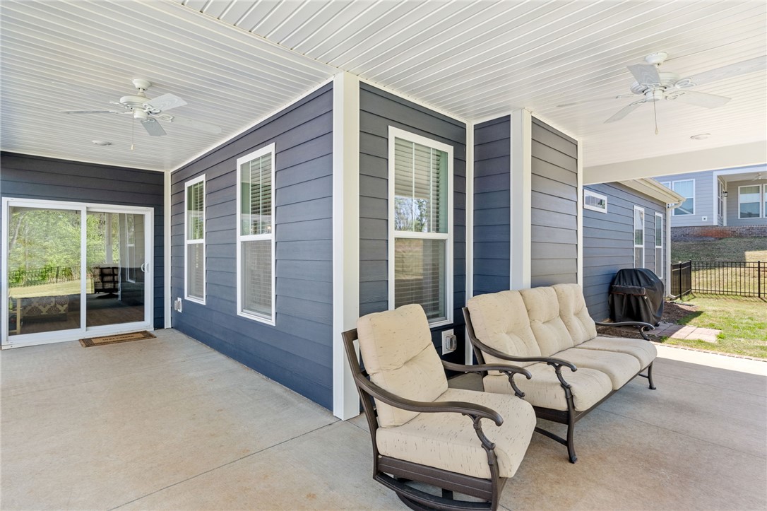 210 Maverick Trail Central, SC 29630 - Photo 31 of 41 An inviting covered patio offers a comfortable outdoor space for relaxation and enjoyment.