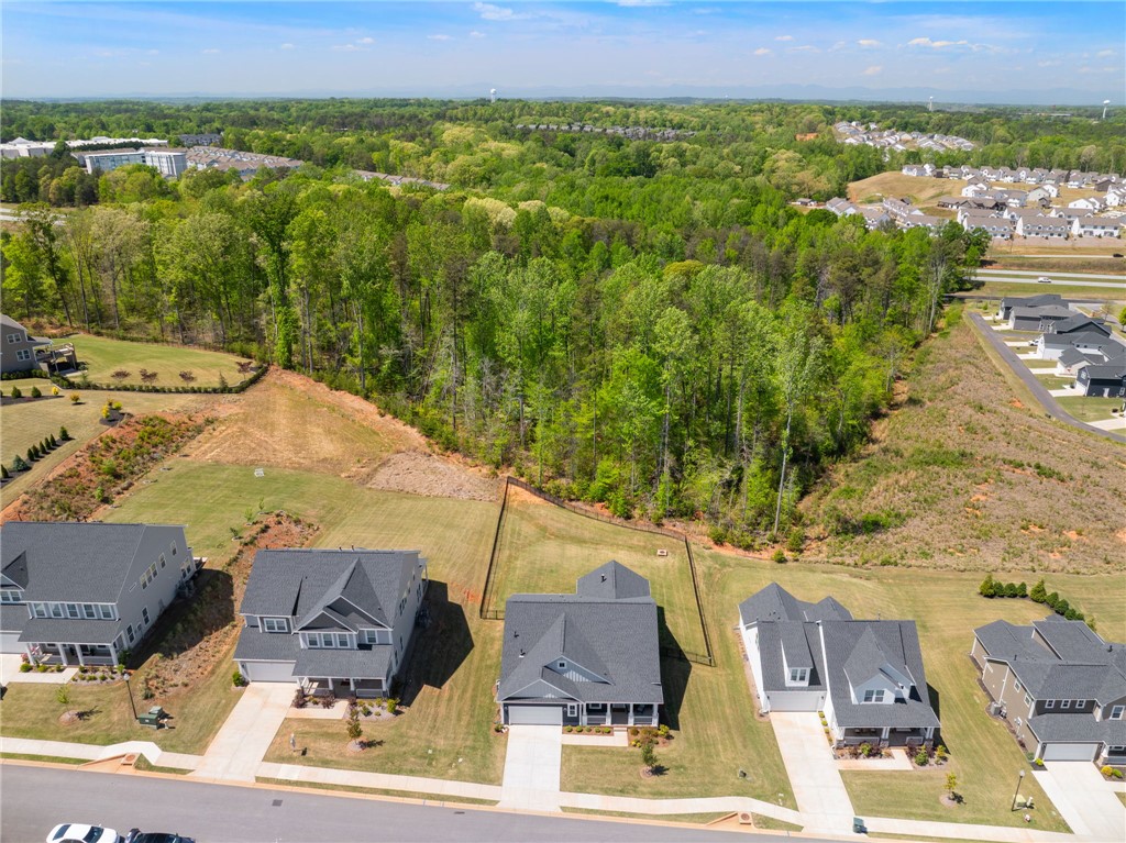 210 Maverick Trail Central, SC 29630 - Photo 39 of 41 This elevated view captures homes nestled against a verdant tree line under an expansive sky.