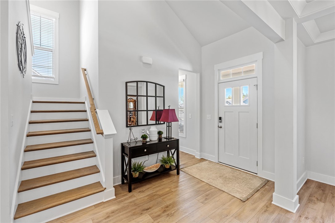 210 Maverick Trail Central, SC 29630 - Photo 6 of 41 This bright entry offers a welcoming ambiance, connecting seamlessly to a staircase with warm wooden treads.
