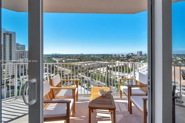 a view of balcony with furniture