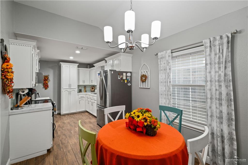 718 Hummingbird Avenue Pharr, TX 78577 - Photo 6 of 13 a view of a dining room with furniture