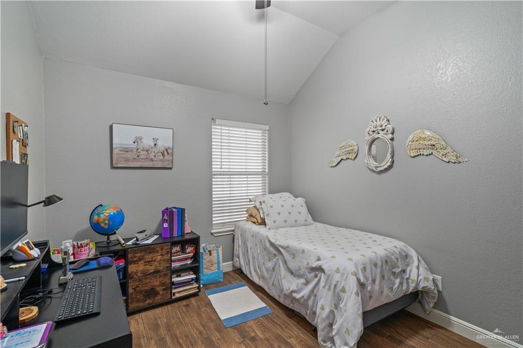718 Hummingbird Avenue Pharr, TX 78577 - Photo 7 of 13 a bedroom with a bed and a window