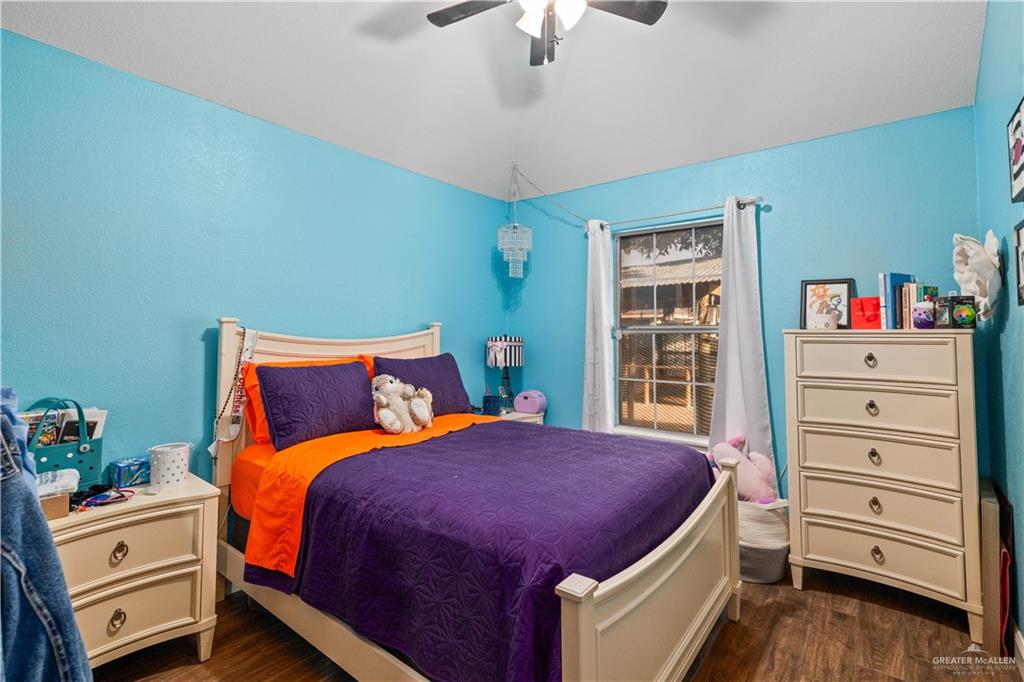 718 Hummingbird Avenue Pharr, TX 78577 - Photo 8 of 13 a bedroom with a bed and furniture