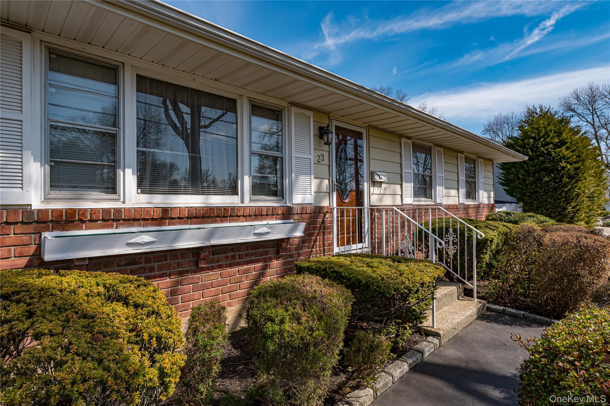23 Olga Lane Commack, NY 11725 - Photo 2 of 17 a house view with a garden space