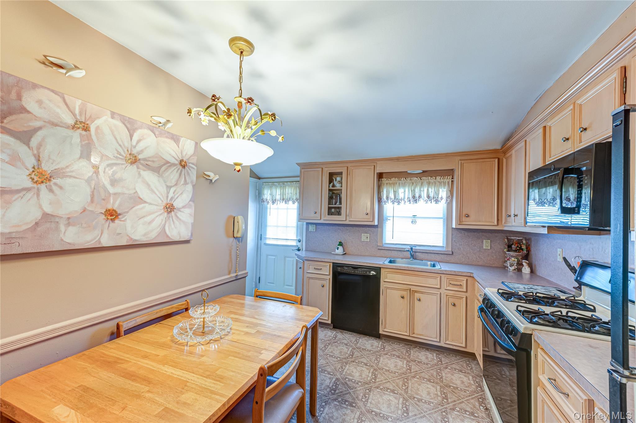 23 Olga Lane Commack, NY 11725 - Photo 7 of 17 a kitchen with a sink stove and microwave