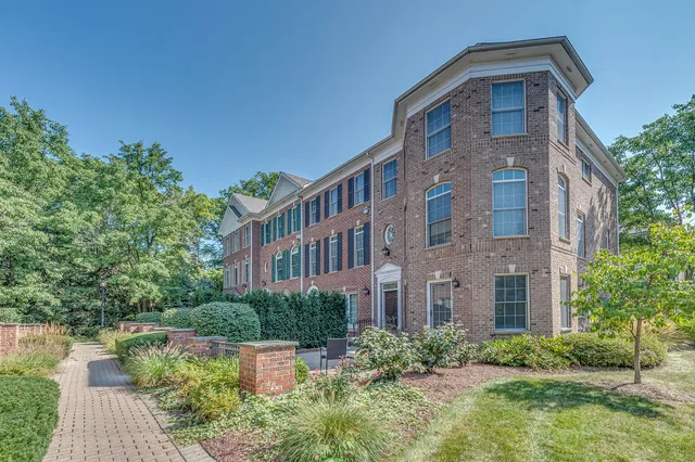 a front view of a building with garden