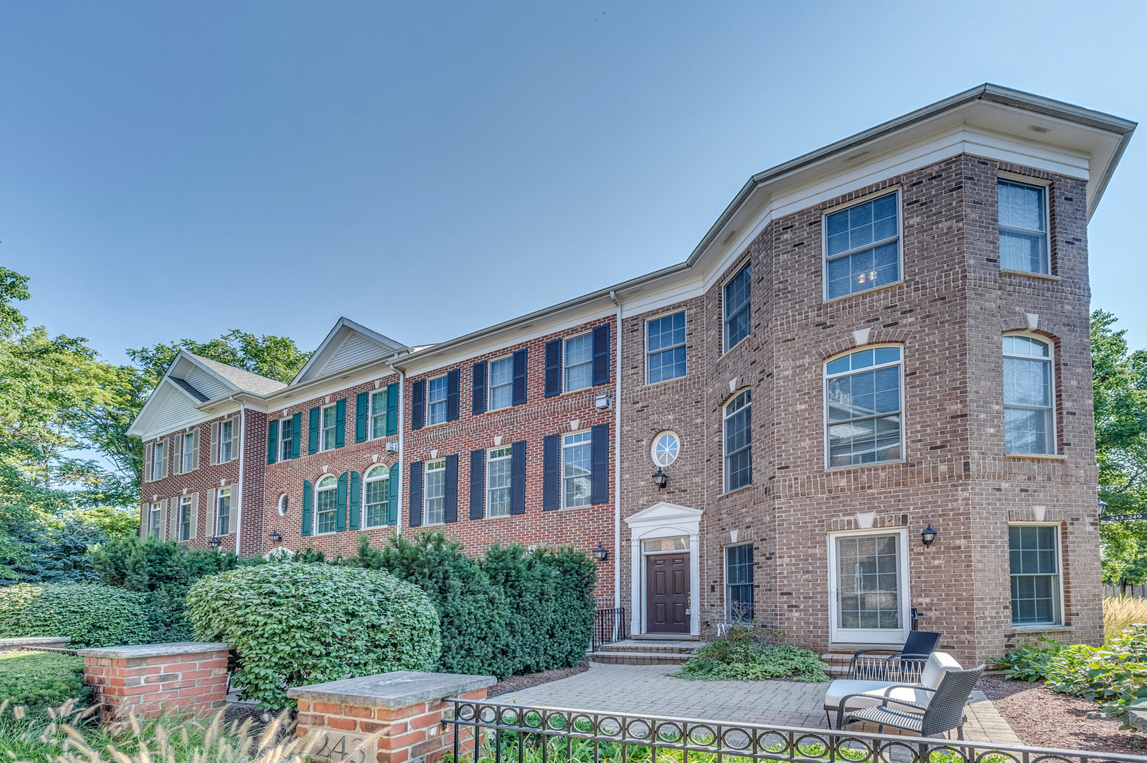 243 Boxcar Avenue Naperville, IL 60540 - Photo 2 of 29 a front view of a brick house with a yard