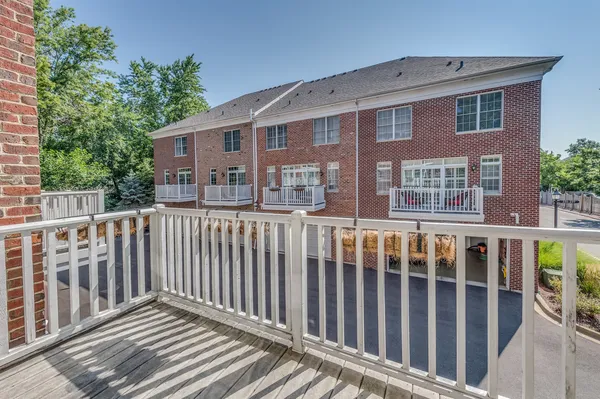 a view of a brick building from a balcony
