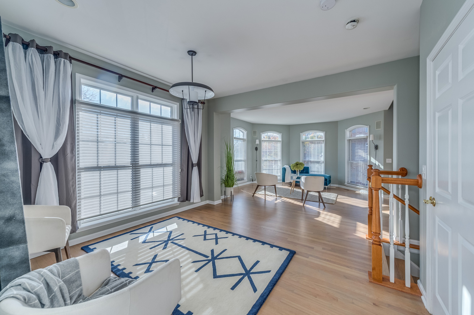 243 Boxcar Avenue Naperville, IL 60540 - Photo 10 of 29 a living room with furniture a table and a large window
