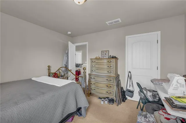 a bedroom with a bed and furniture