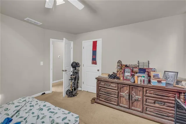 a bedroom with furniture and a window
