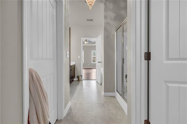 a view of a bathroom from a hallway