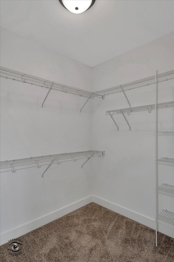 362 White Hawk Way Manteno, IL 60950 - Photo 18 of 27 a view of a room with racks on the wall
