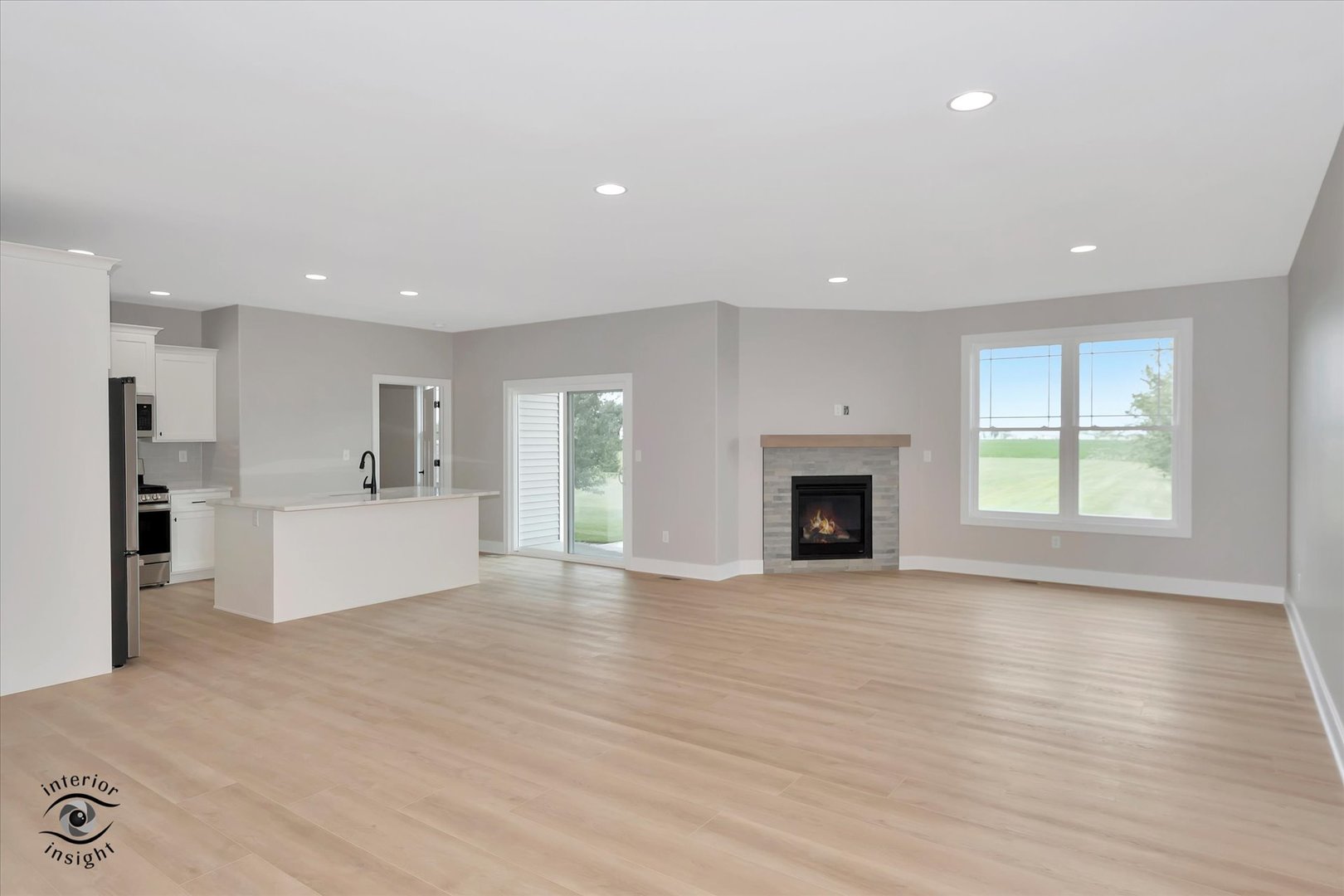 362 White Hawk Way Manteno, IL 60950 - Photo 5 of 27 a view of an empty room with a fireplace and a window