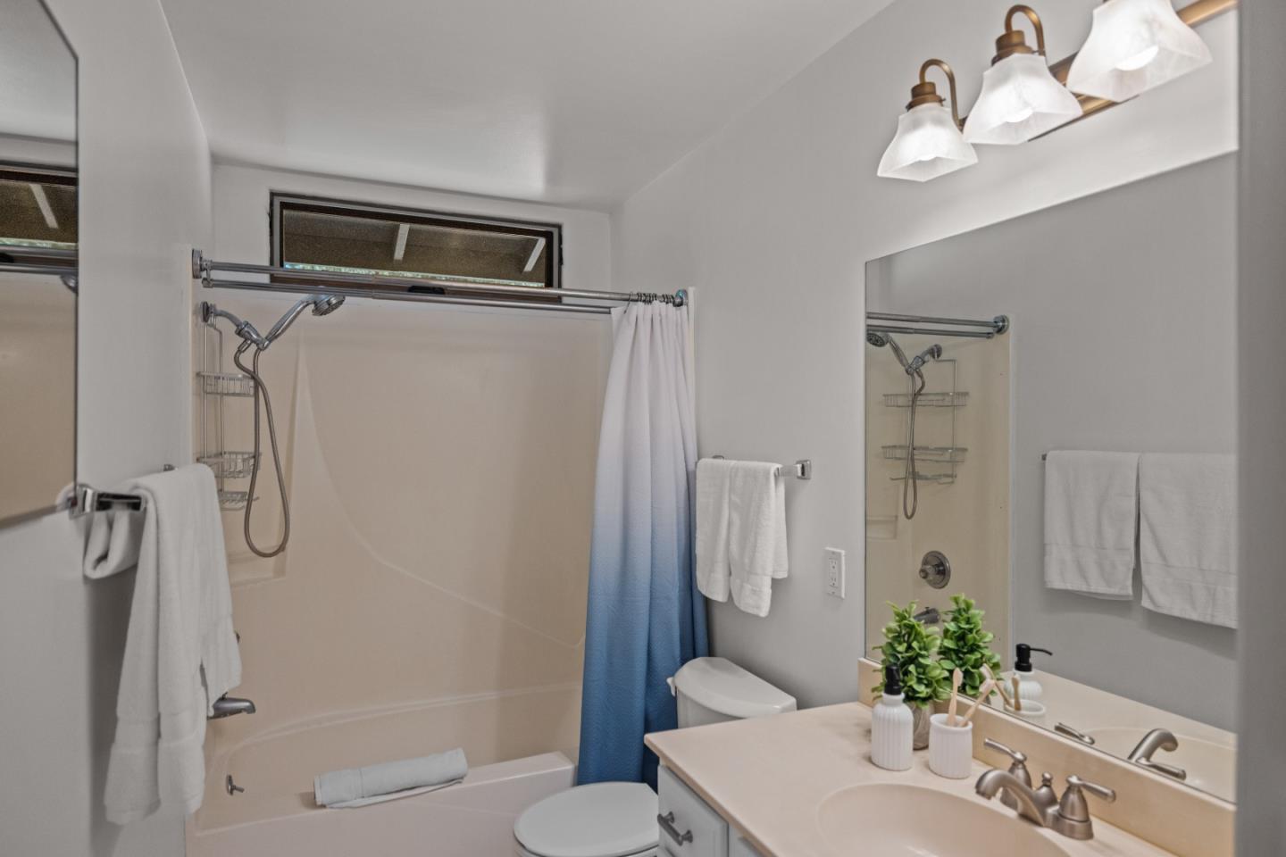 11660 McCarthy Road Carmel Valley, CA 93924 - Photo 13 of 21 a bathroom with a shower a sink and mirror