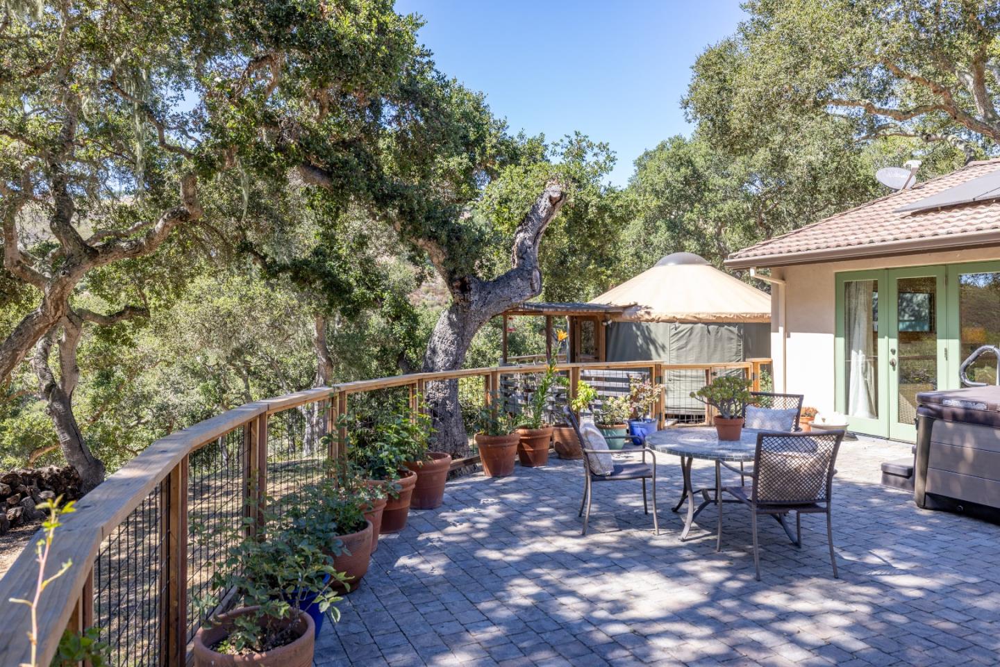 11660 McCarthy Road Carmel Valley, CA 93924 - Photo 16 of 21 a view of a chair and tables in the balcony