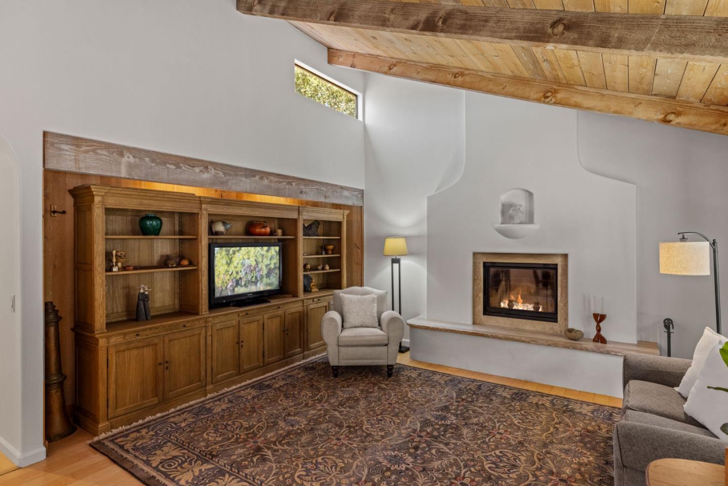 11660 McCarthy Road Carmel Valley, CA 93924 - Photo 2 of 21 a living room with furniture and a fireplace
