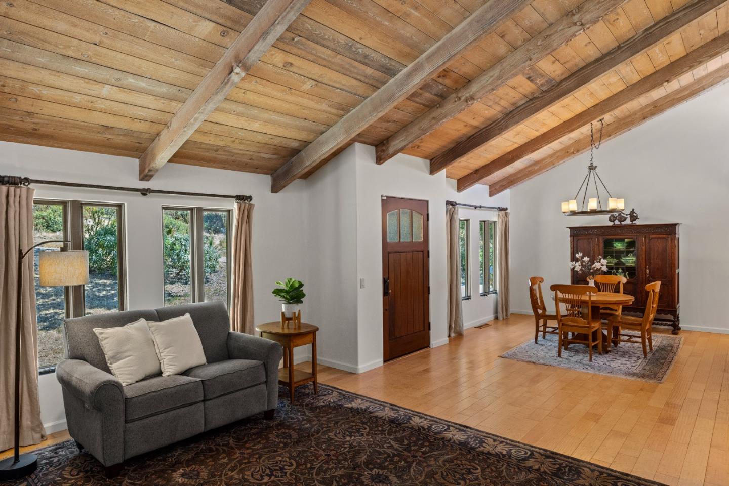 11660 McCarthy Road Carmel Valley, CA 93924 - Photo 4 of 21 a living room with furniture and a chandelier