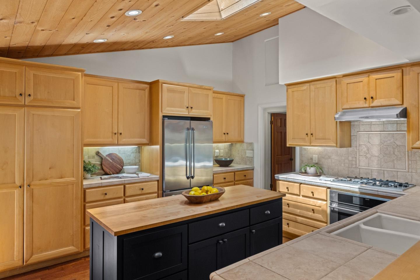 11660 McCarthy Road Carmel Valley, CA 93924 - Photo 7 of 21 a kitchen with stainless steel appliances granite countertop a sink a stove and a refrigerator